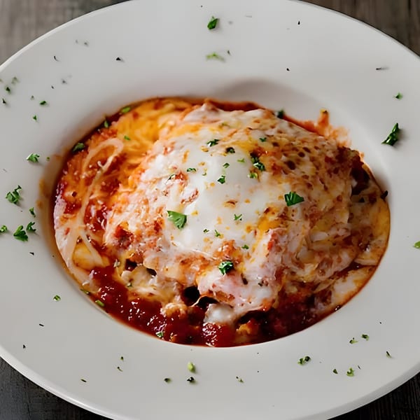 Piu Bello Buckhead's lasagna, a hearty portion of pasta baked with rich tomato sauce and melted cheese.